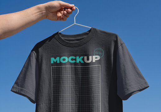 Tshirt Design Hand Holdilg Hanger Branding Mockup