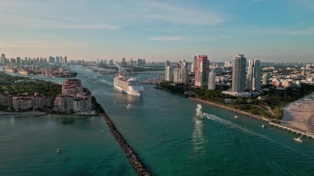 Aerial view Cruise ship sailing next to Miami South Beach. . cruise ship sailing near South Beach. Cruise liner sailing from Miami harbor. Cruise vacation