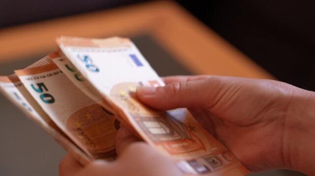 Close-up of euro banknotes representing finance, banking, investment, savings, payments, and the European economy.