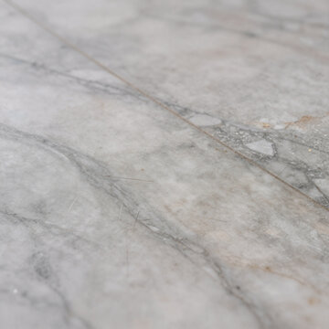 Anime Marble Quality. A Worn, Distressed Marble Tile With Numerous Scratches And Imperfections