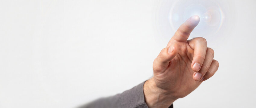 Virtual touchscreen interface touched by index finger with glowing lens flare effect on minimal white background for digital tech innovation and interactive business concepts