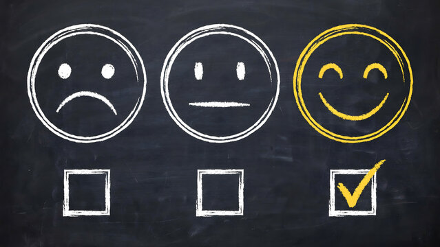 Feedback survey choice with happy smiley face selected on a chalkboard