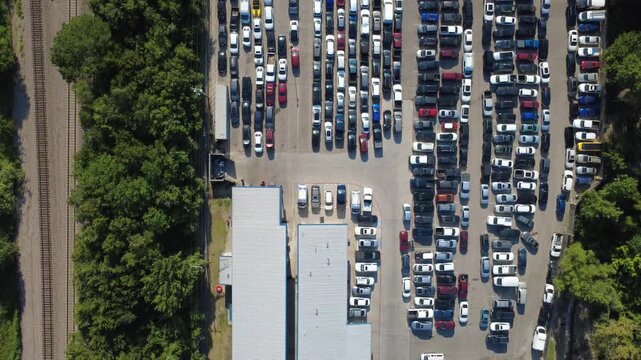 Parallel metal warehouse roofs extend over commercial storage facilities following established local architectural patterns. Distribution structures anchor industrial operations in Irving, TX