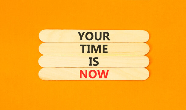 Your time is now words symbol. Concept words Your time is now on beautiful wooden sticks. Beautiful orange background. Business support motivational your time is now concept. Copy space.