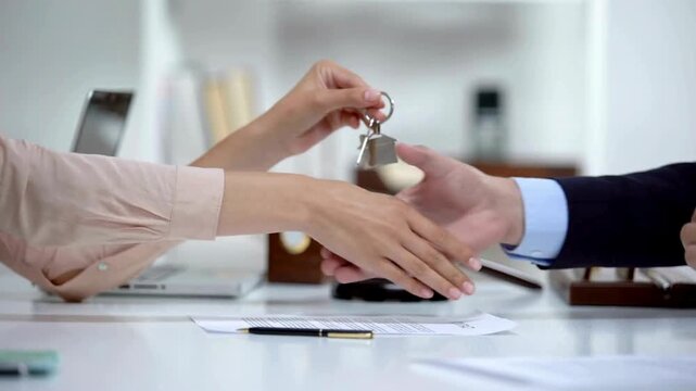 4k high resolution stock viClose Up of Business People Shaking Hands in Office Meeting with Contract Documents, Laptop and Paper on Desk Representing Teamwork, Agreement and Professional Collaboration