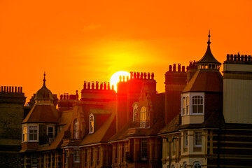 Fototapeta premium Orange Sunset Behind Historic Brighton Rooftops