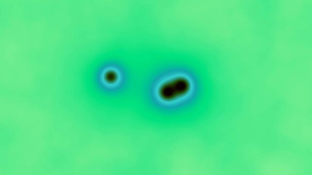 Abstract Microscopic Animation of Three Biological Cells Dividing on a Vibrant Green Background