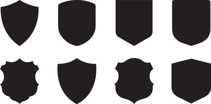 A collection of various heraldic shield shapes presented in a simple and clean black and white graphic design style silhouette