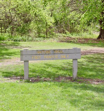 A close view of the wood nature trail sign.