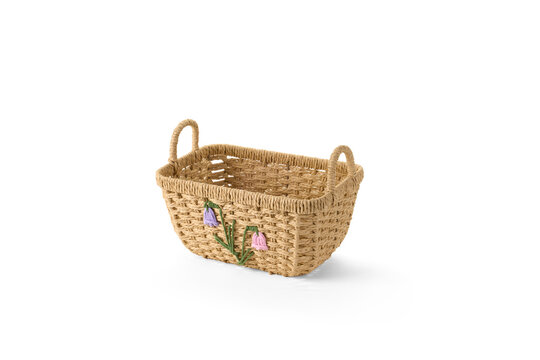 Woven straw storage basket with two handles and decorative flower design for home decor organization