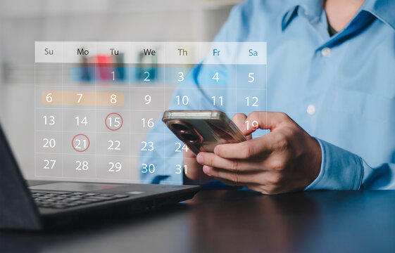 Businessman using a smartphone with a digital calendar interface to manage appointments, schedule meetings, plan projects, organize tasks, and improve productivity through mobile planning.