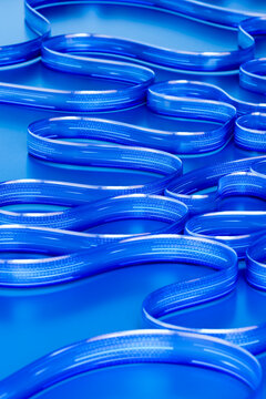 3D digital loop landscape with blue curves and code texture.