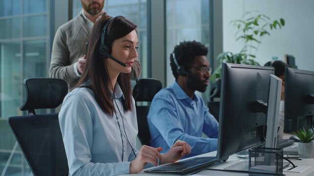 Three diversity operators working in call center angry CEO checking business work dissatisfied talking to intern sad woman. Group multiethnic team work in callcenter boss check bad job talk negative