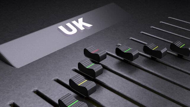UK text on mixing console fader, British economic control concept, United Kingdom market adjustment on audio slider board