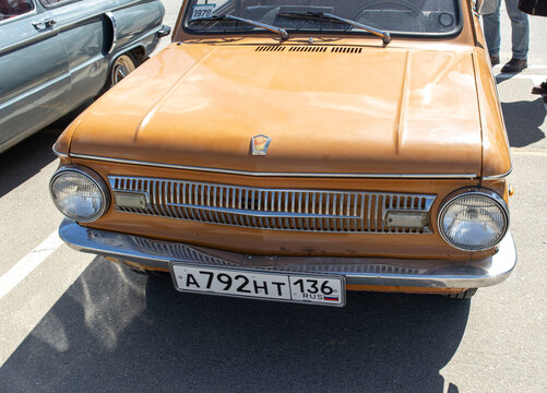 VORONEZH, Russia - April 25, 2026.Classic ochre colored ZAZ Zaporozhets car shows chrome grille and round headlights in close view at a car event