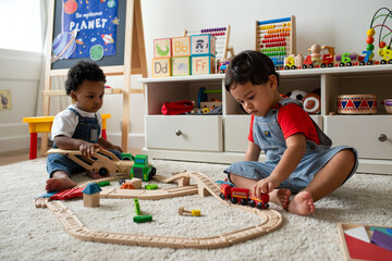 Fototapeta na wymiar Children playing with wooden toys