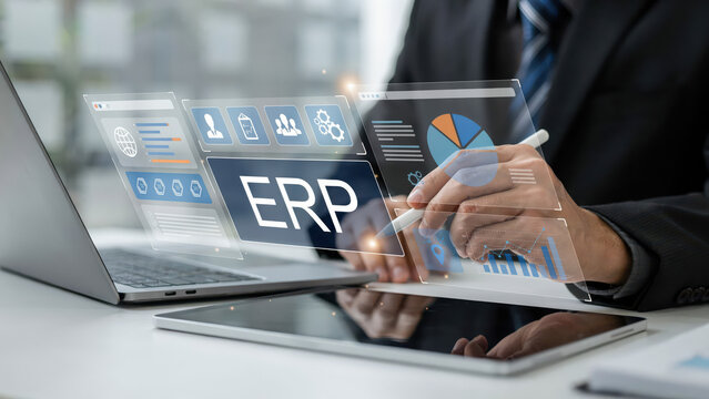 Businessman analyzing enterprise resource planning software on digital screen.