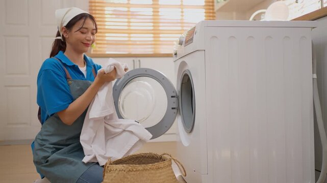 Laundry Woman Sorting Shirt From Basket Beside Washing Machine Wearing Apron In Bright Home Laundry Room For Clean Chore Housework With Fresh Clothing