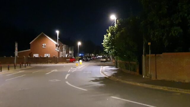 Low Angle Illuminated Streets View of Luton City of England United Kingdom After Sunset Night. Wide Angle Camera Footage Was Captured During Walk at Night of June 27th, 2026. 