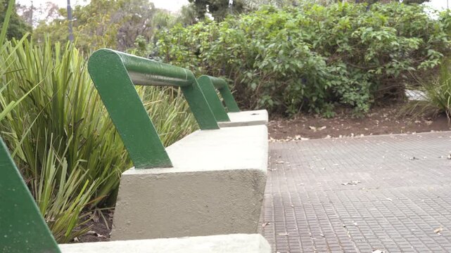Cement benches with metal backs in a square
