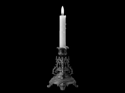 Gothic metal candlestick with burning white candle isolated on transparent background. Perfect for spooky lighting.
