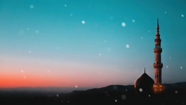 Magnificent mosque minaret standing against a beautiful gradient twilight sky with soft falling snow for serene spiritual ambiance
