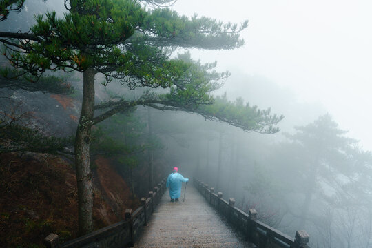 Anonymous person in raincoat in Huangshan, China 