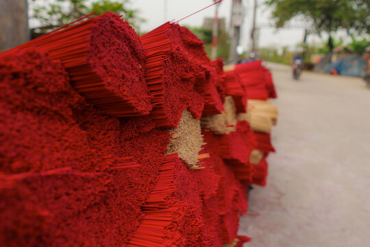 Bundles of dyed bamboo sticks on incense production 