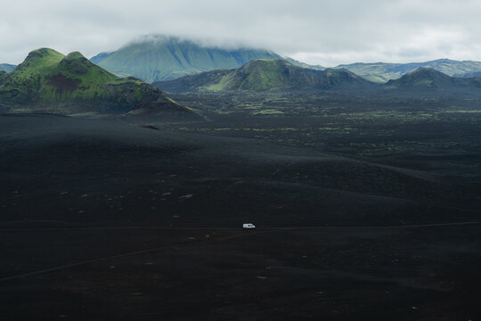 Camper on the  dirt road in the middle of nowhere in Iceland 