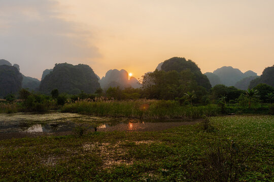 Sunset behind karst mountains in Viet Nam 