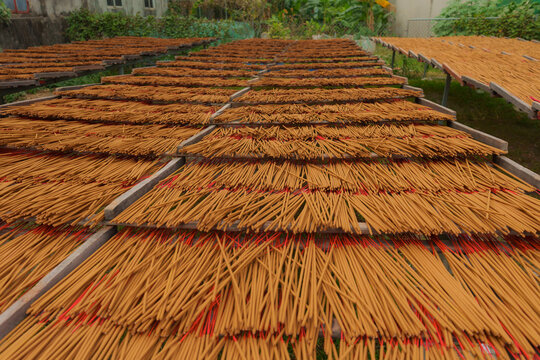 Brown incense sticks  drying in Vietnamese village 