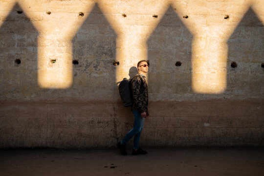 Male traveller visiting a fortrass in Morocco