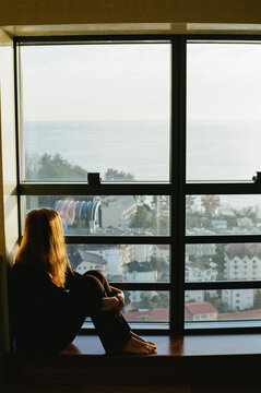 Young woman at the window