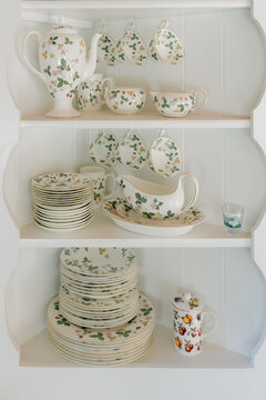 tea cup and tableware on shelves 
