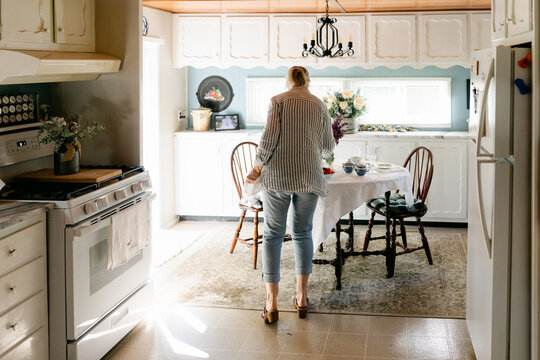 woman preparing a table to have tea