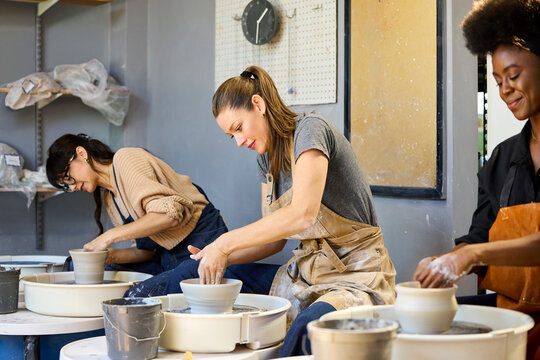 Friends during the making of clay bowls
