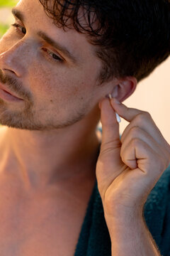 Man cleaning his ear