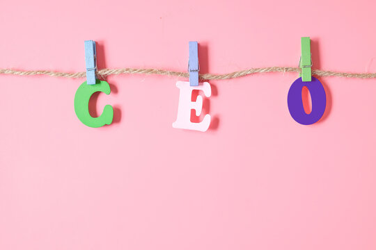 Alphabet wood letters  CEO hang on hemp rope.
