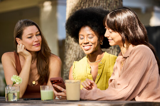 Friends Sip Drinks Outdoors