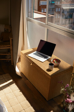 Open laptop and breakfast