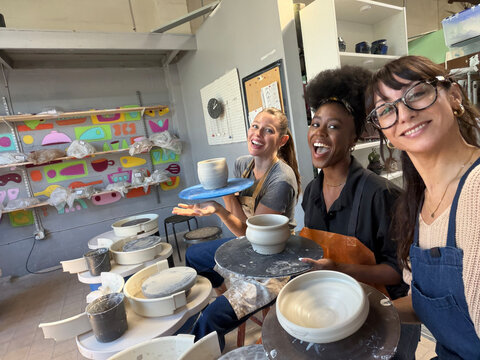 Real UGC POV selfie of Three Friends Making Pottery in a Studio