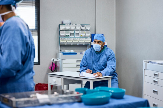 Medical Staff in Blue Scrubs Work in a Clinic