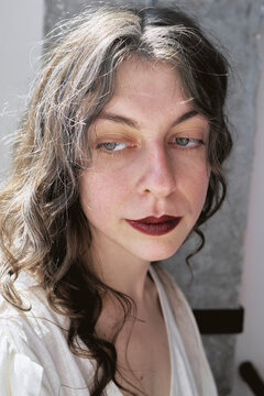 Woman with wavy hair in a studio setting during a photoshoot