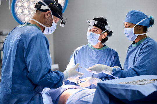 Medical team collaborates in surgical procedure