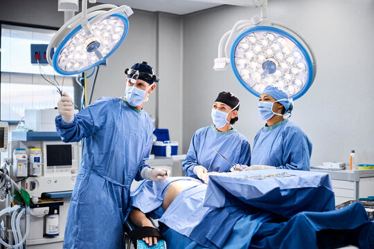 Surgical team prepares for operation in modern operating room