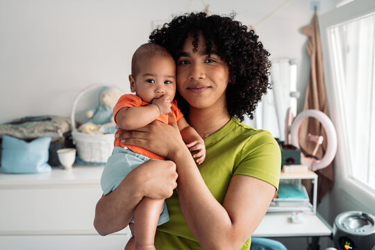 Mother embracing baby showing love and parenthood