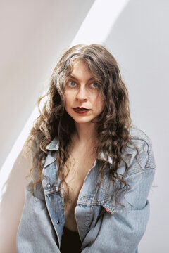 Woman in studio with natural light and casual outfit