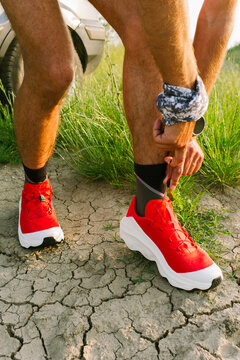Running Shoes on a Person Tying Laces in an Outdoor Setting