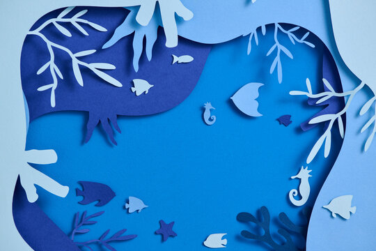 A vibrant and whimsical underwater scene created with paper