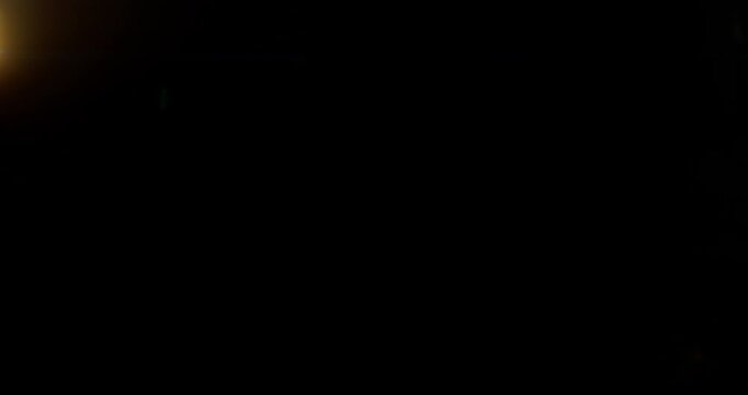 Blue anamorphic lens flare moving overlay in super slow motion featuring cinematic horizontal light streaks, realistic optical reflections and dynamic glow on a black background. Premium VFX asset.